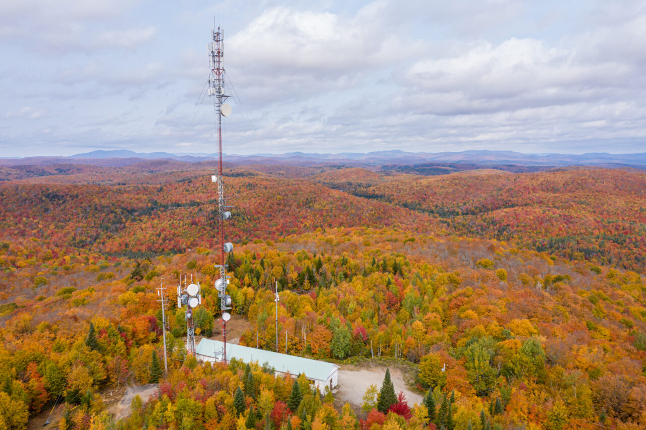Aerial Picture of Cellular Antenna with Fall colors of a forest in Autumn Season. Taken in the Laurentian’s Mountains, Quebec, Canada